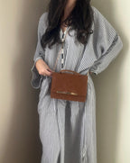 Slippers and clutch bag